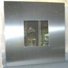 Wall mirror in brushed steel frame